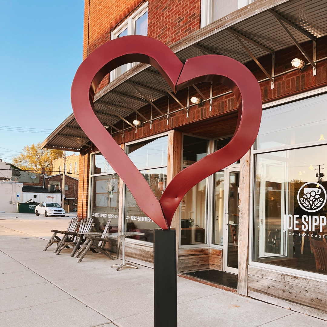 a full shot of a heart statue in downtown effingham