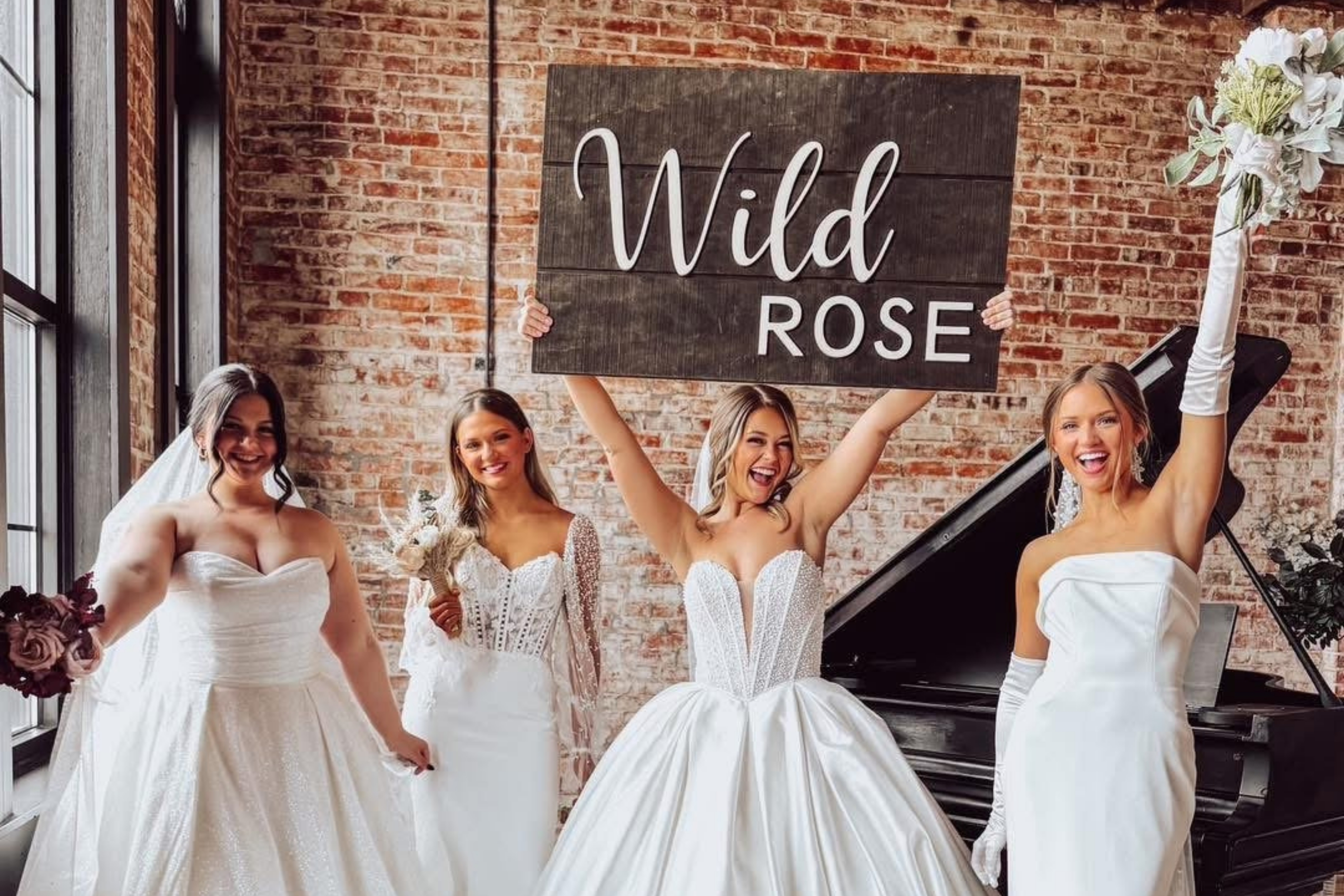 models holding up a wild rose sign enthusiastically