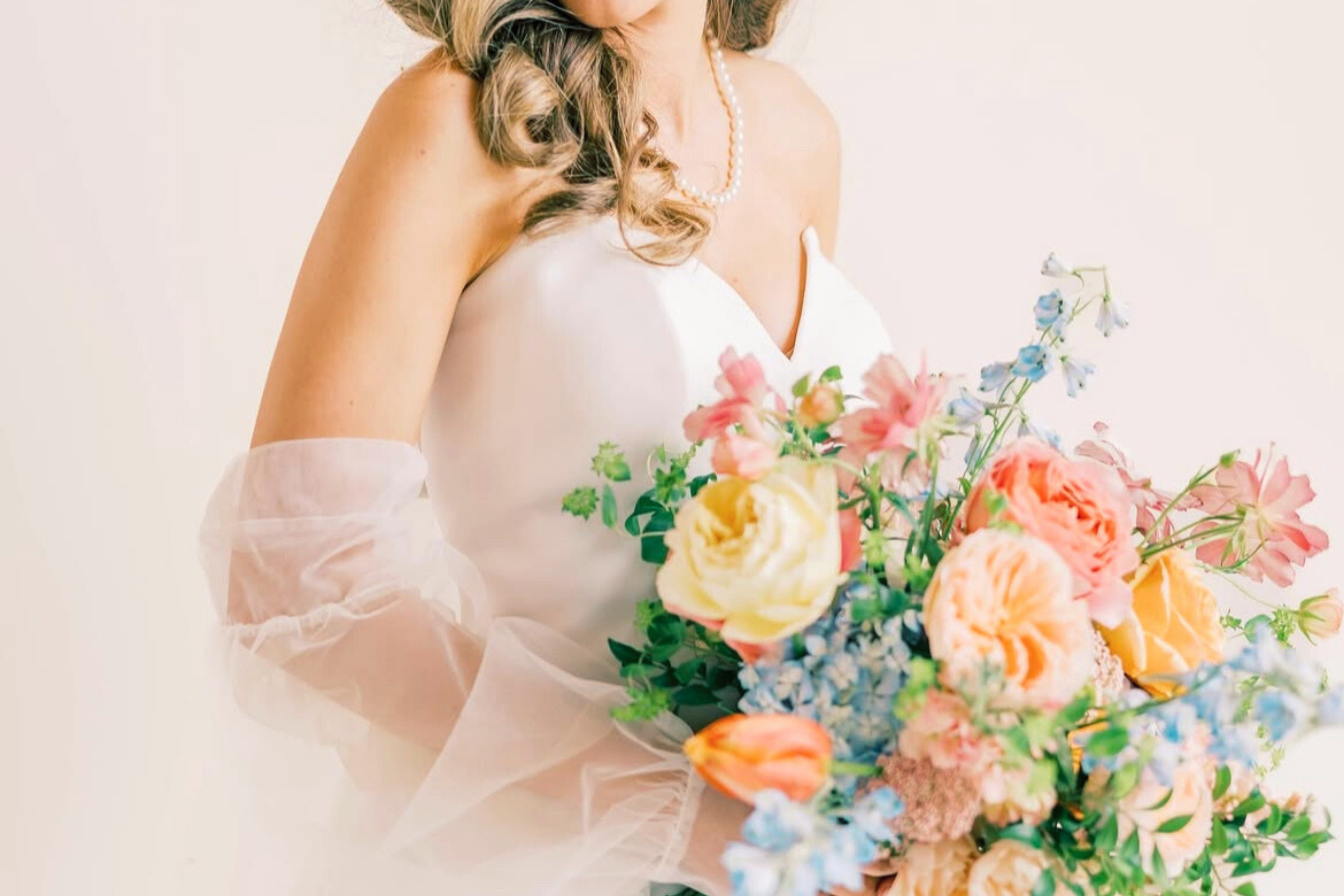 bride in a dress holding flowers