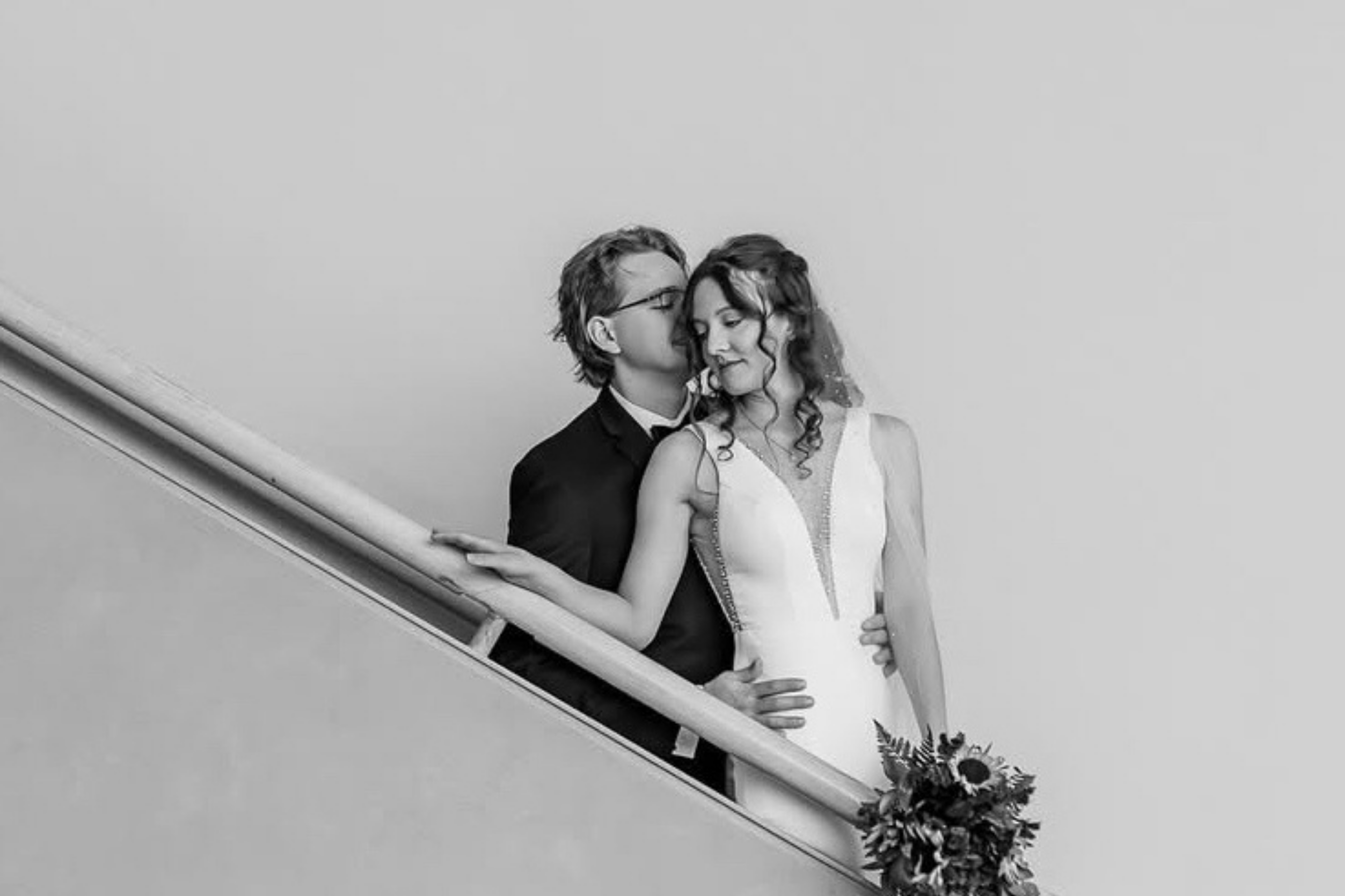 bride and groom on staircase