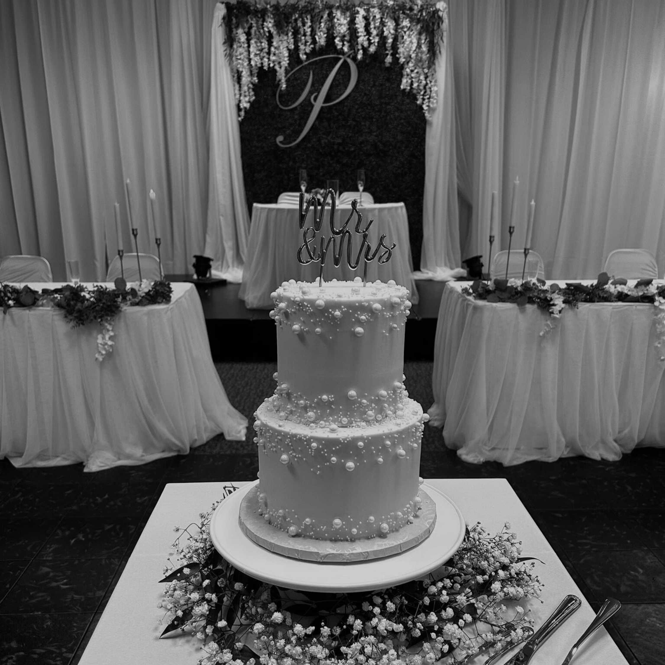 wedding cake adorned with pearl decorations