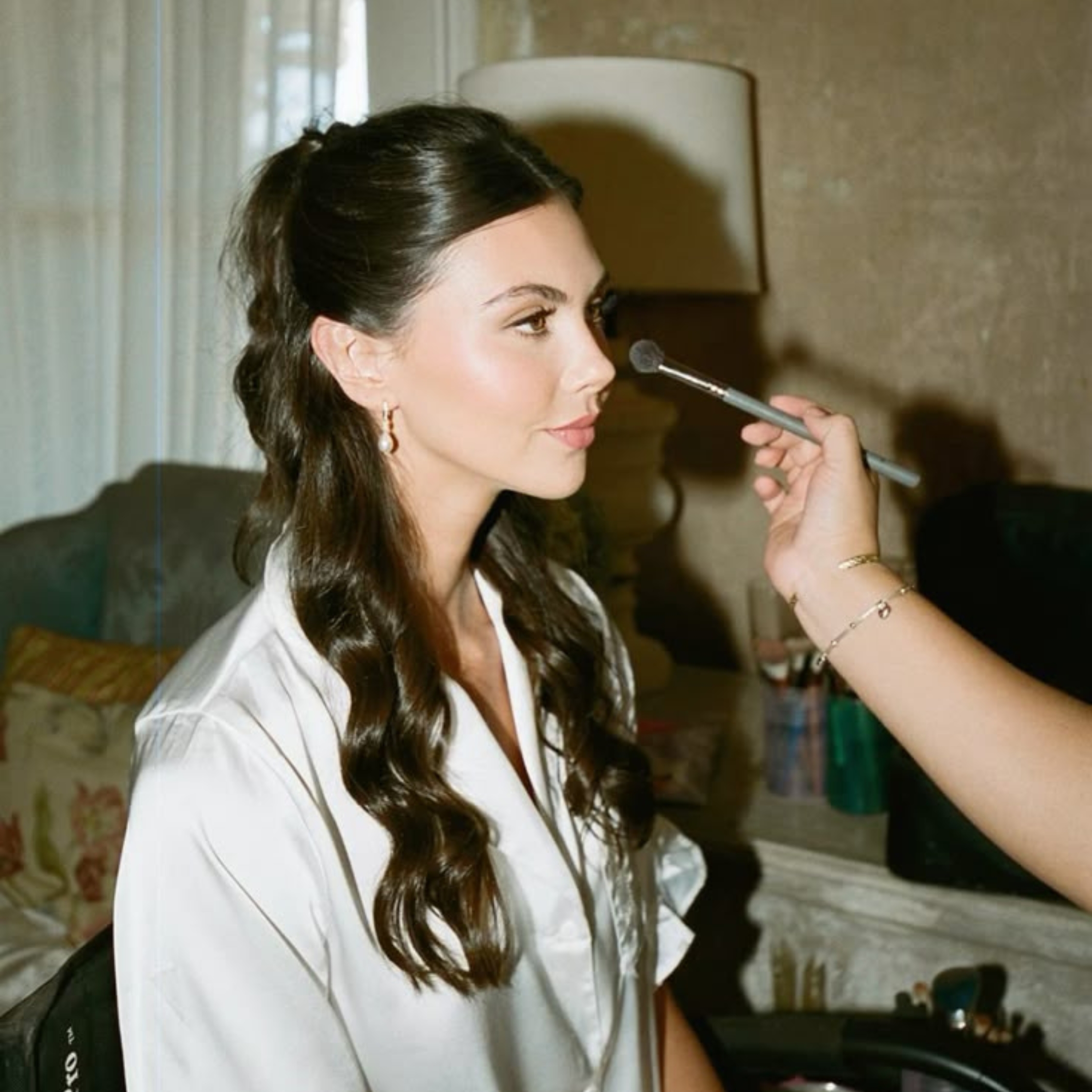 bride getting her makeup done