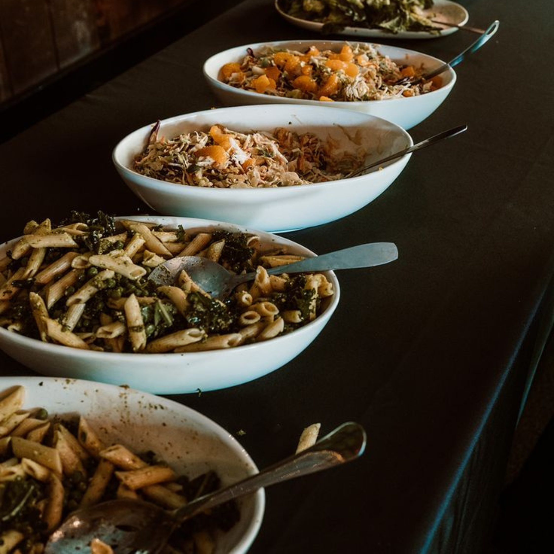 a lineup of bowls of pasta
