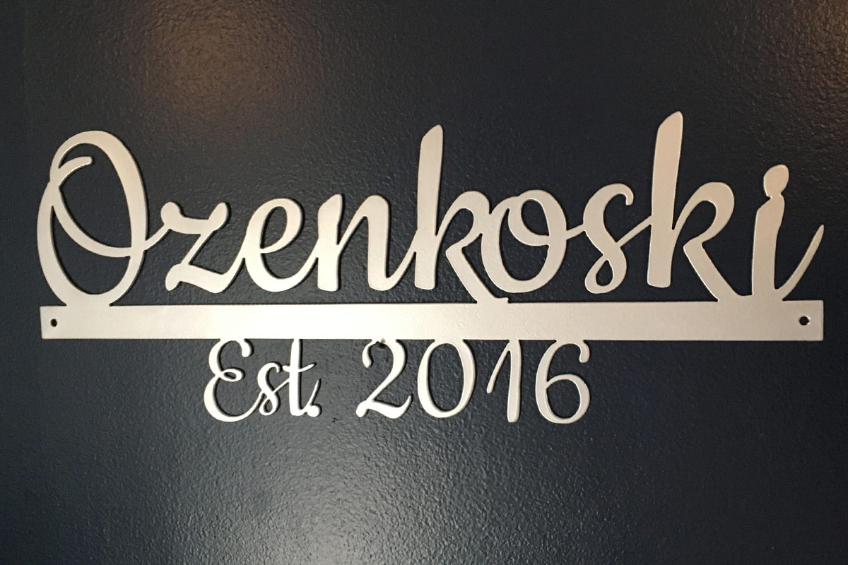 metal work featuring the last name of Ozenkoski