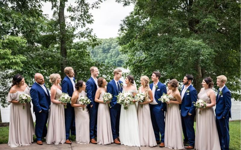 bride and groom lined up between their bridal party
