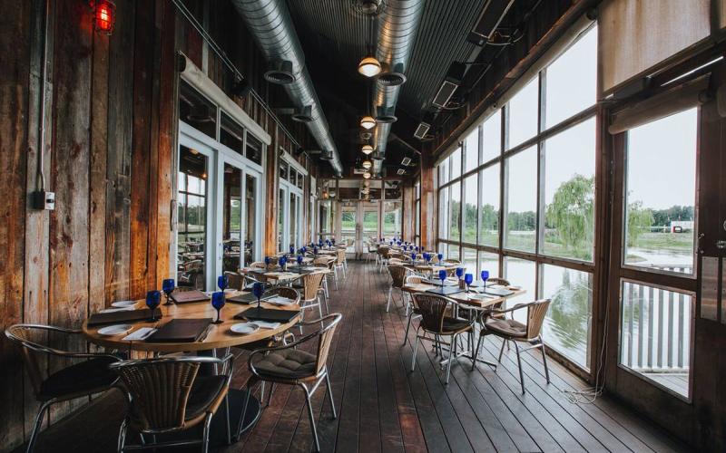 room at Firefly Grill with a view of the pond through the windows